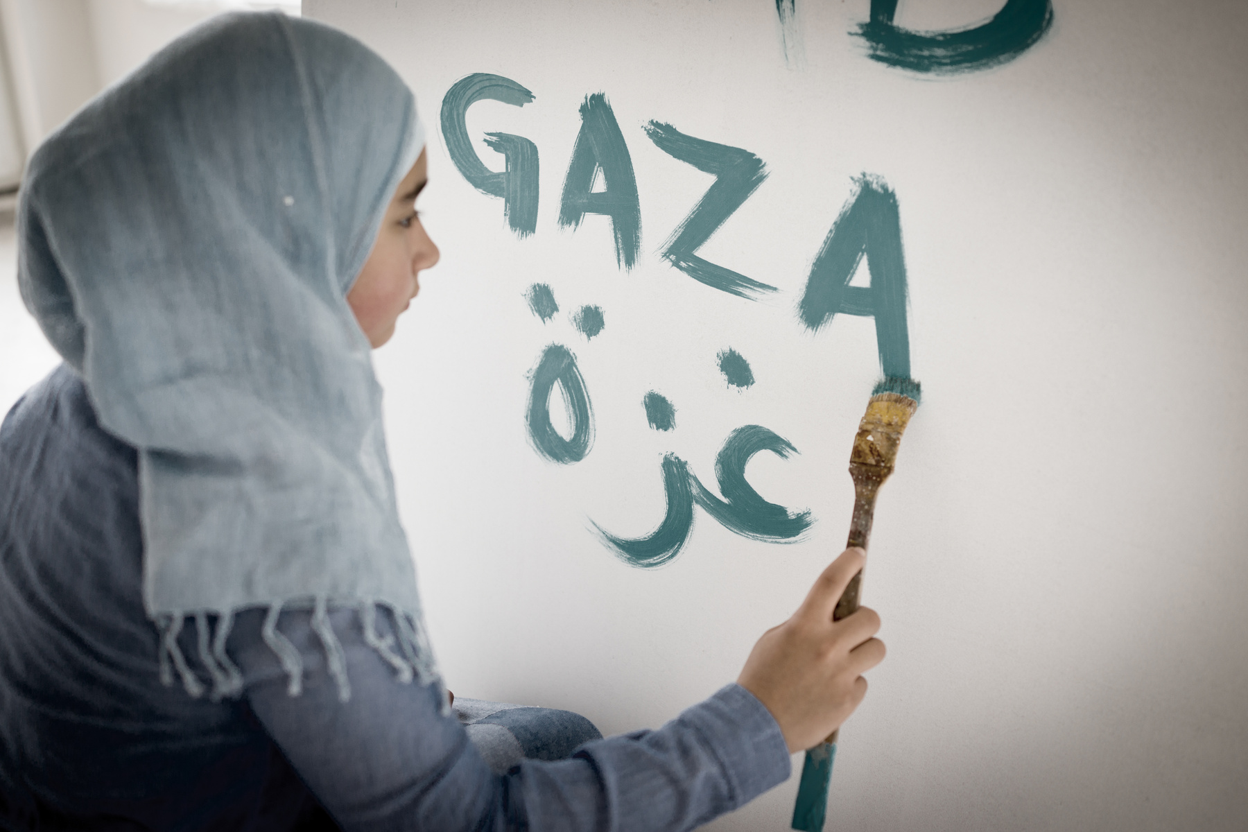 Arabic Muslim Girl Writing Messages on Board